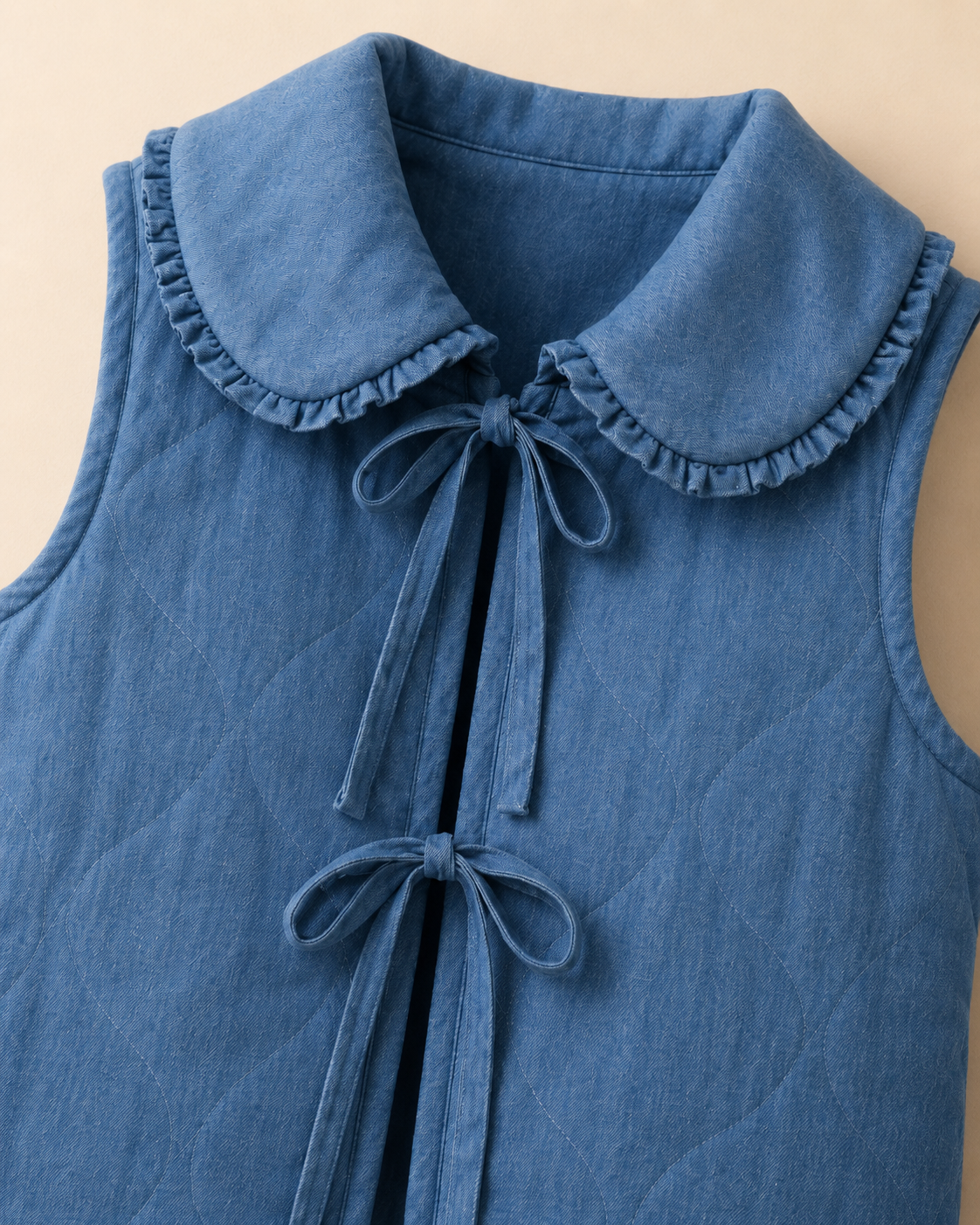 QUILTED PADDED TIE FRONT DENIM VEST