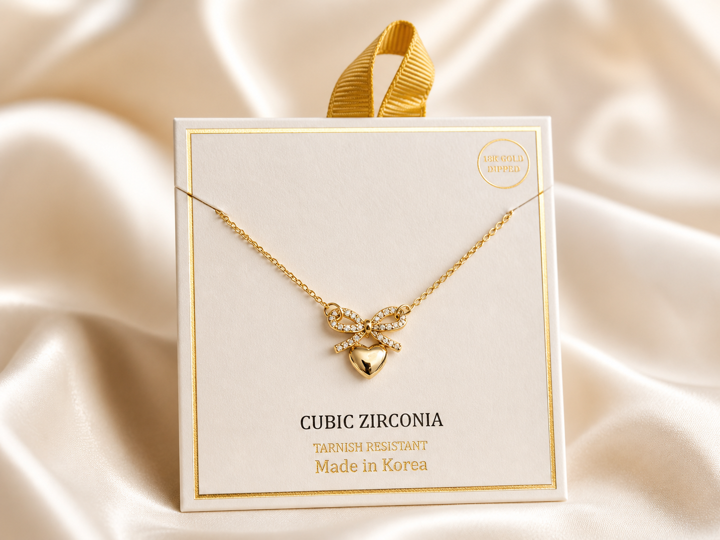 CUBIC ZIRCONIA HEART PAVED BOW